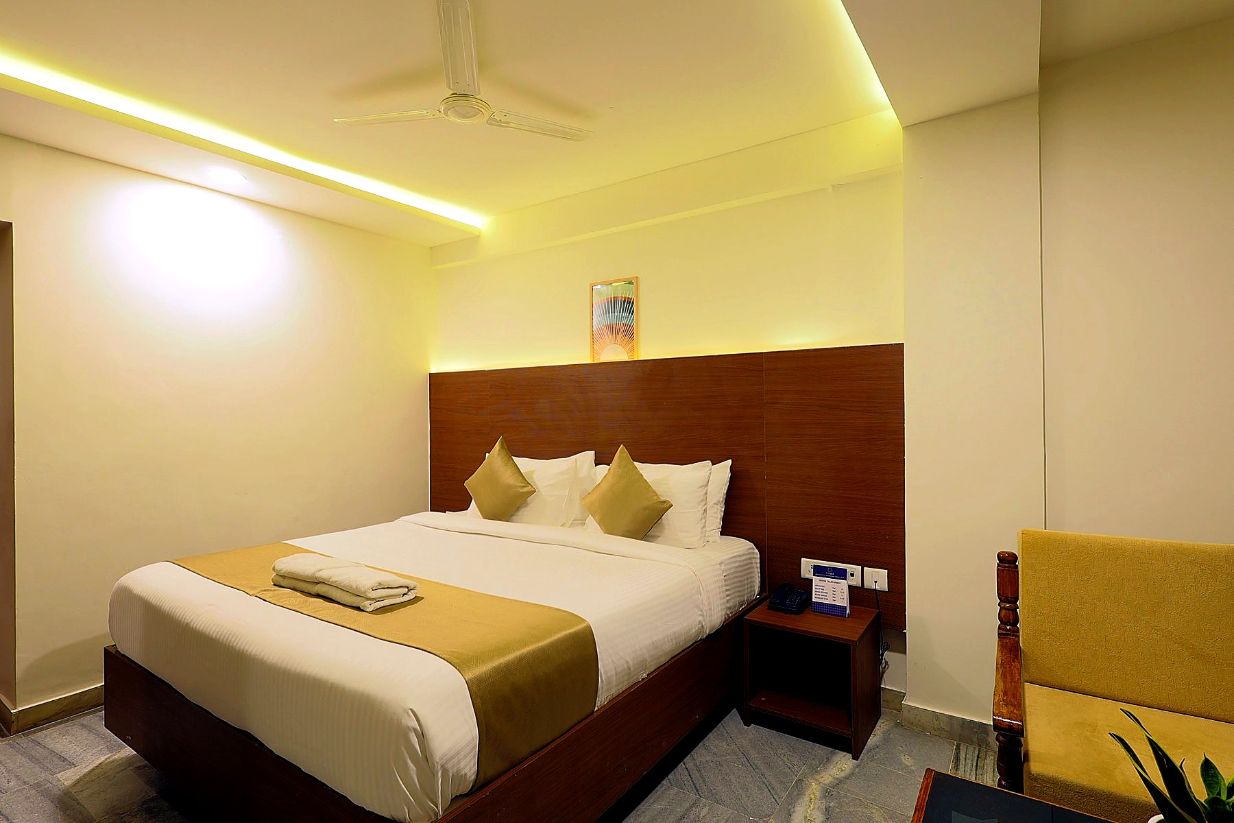 Bright Executive Room with framed art and seating