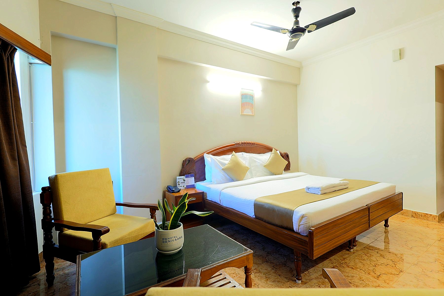 Executive Room with plush bedding and lounge chairs