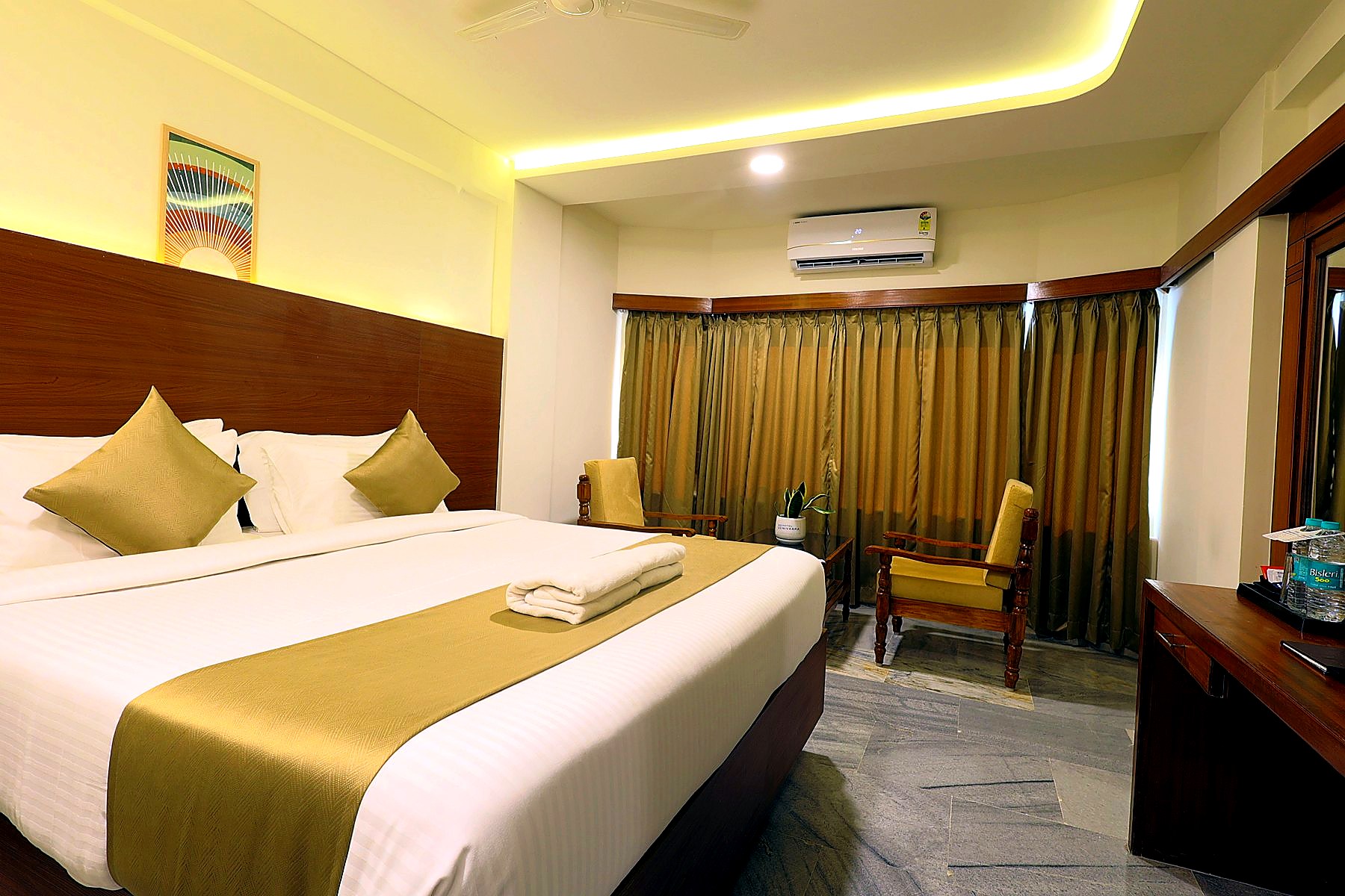 Warm-lit Executive Room with king bed